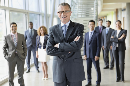 business people standing in office hall